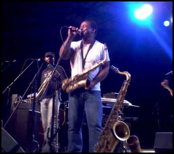 Karl Denson at the mich with trumpet player Chris Littlefield to his right.